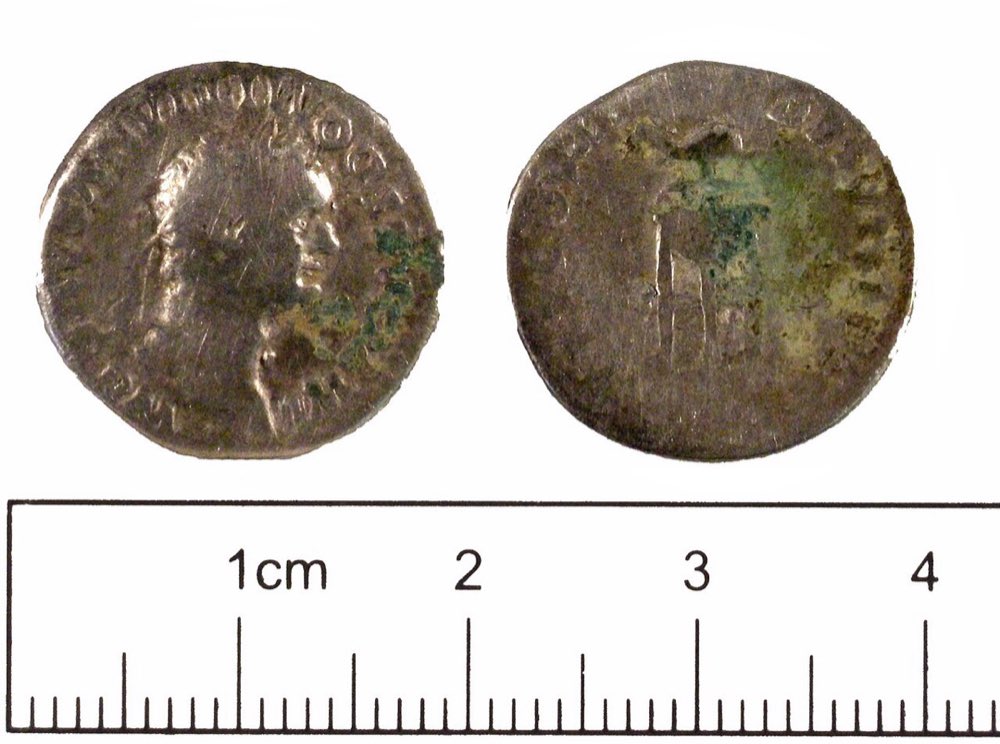A Roman silver denarius of Domitian, left uncleaned beyond loose soil