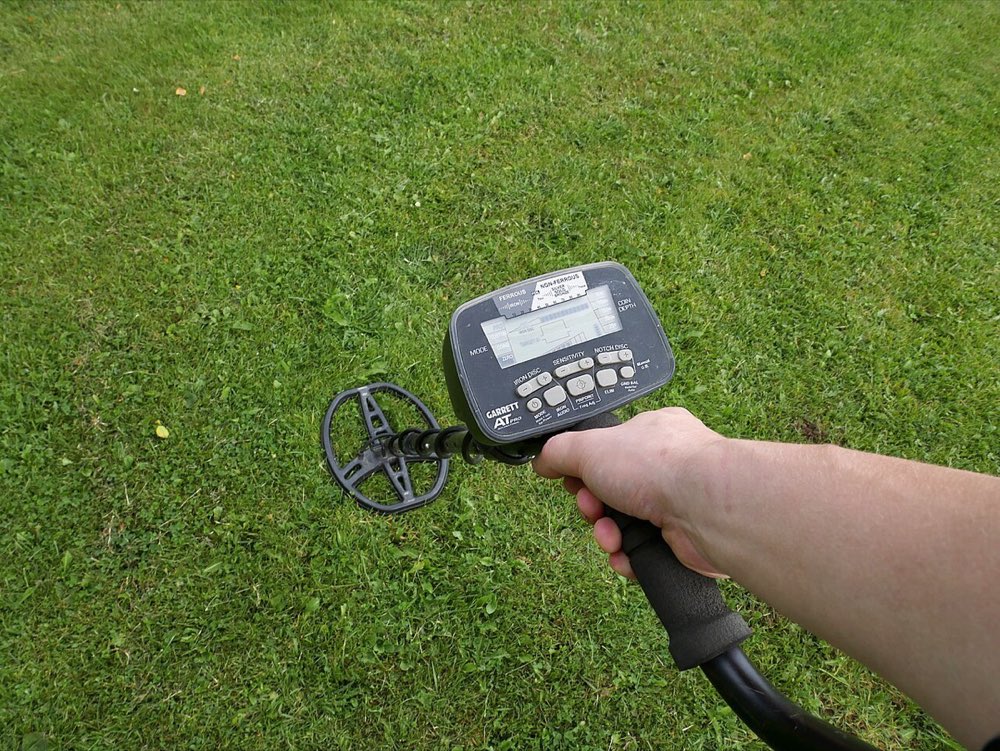 A detectorist searching a field