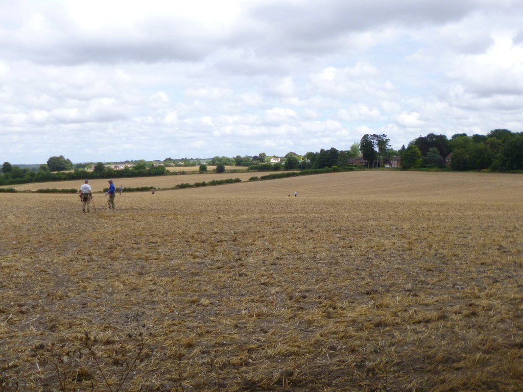 Detectorists searching a field at Weeke, Hampshire